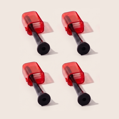 Four Solstra replacement brush heads with red caps, arranged in a square on a cream background