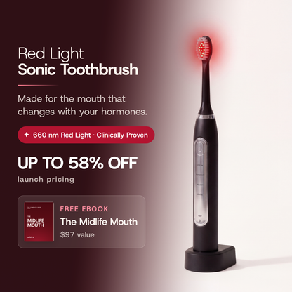 Red Light Sonic Toothbrush. Made for the mouth that changes with your hormones. 660 nm Red Light · Clinically Proven. UP TO 58% OFF launch pricing, with the FREE EBOOK The Midlife Mouth ($97 value). The Solstra toothbrush stands on its charging base, its head glowing red.
